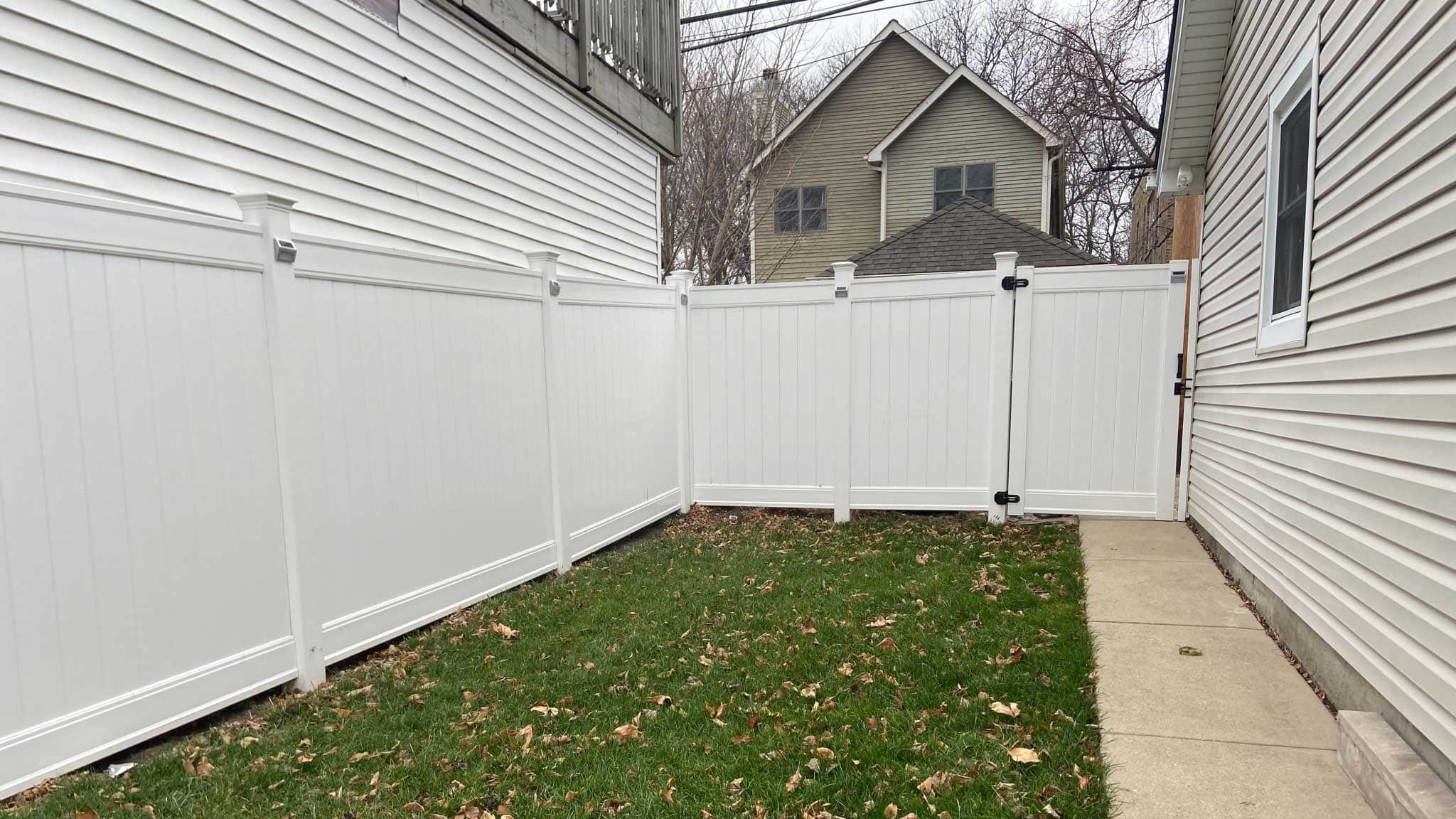 Before photo of side yard with only lawn and aging walkway