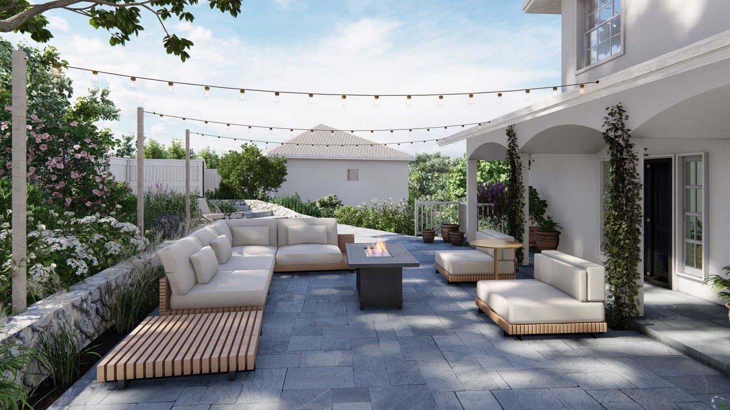 Mill Valley backyard showing string lights over fire pit seating area with lounge sets and flowers