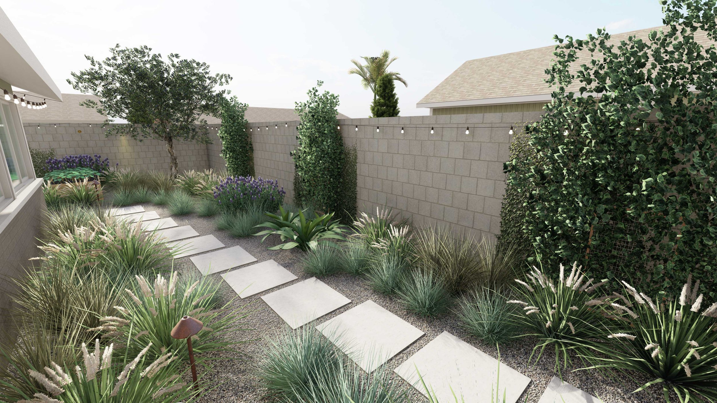 concrete pave walkway sloping down with ornamental grasses on either side